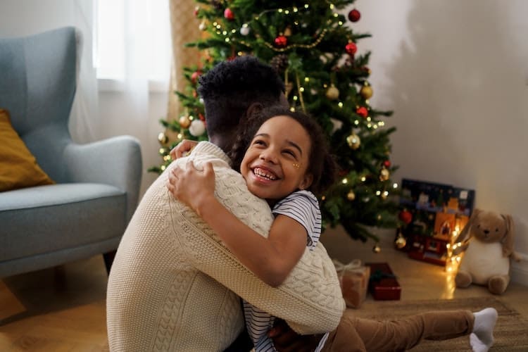 family, holidays, holiday gift, hugging, christmas tree
